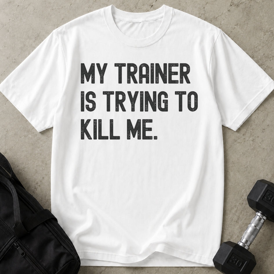 Model wearing the My Trainer Is Trying To Kill Me funny gym t-shirt by Lift Society