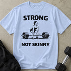 Model wearing the Strong Not Skinny funny gym t-shirt by Lift Society